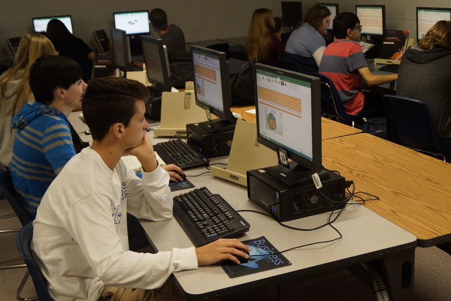 Freshman Caden Merrick works on a computer during third hour Computer Applications. The One-to-One Initiative would supply a laptop to each student.