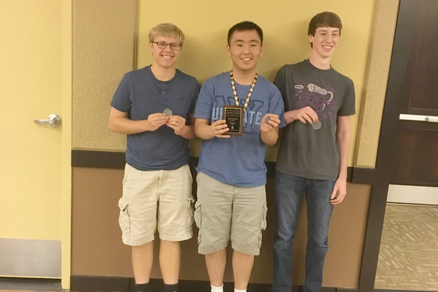 Seniors Kyle Peter, Hyung Ju Nam and Jonah Stiel receive awards at the Emporia State Mathematics Day competition.