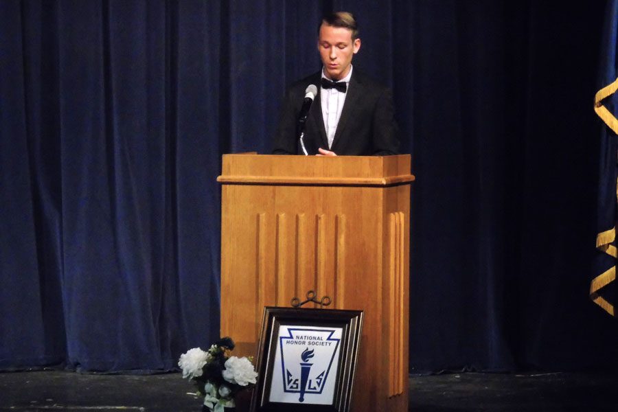 National Honor Society president Anthony Dake welcomes the new inductees on Dec. 7.