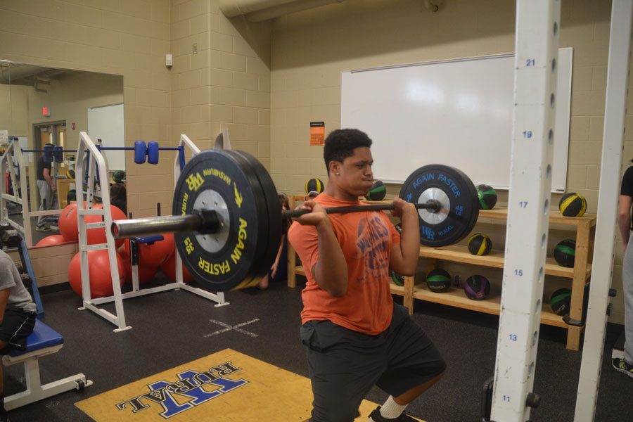 Senior JeShon Edwards performs a hang clean during practice on Jan. 10.