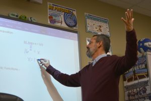 Math teacher Loren Shinn teaches logarithms during his Integrated Math 3 class on Jan. 10. 