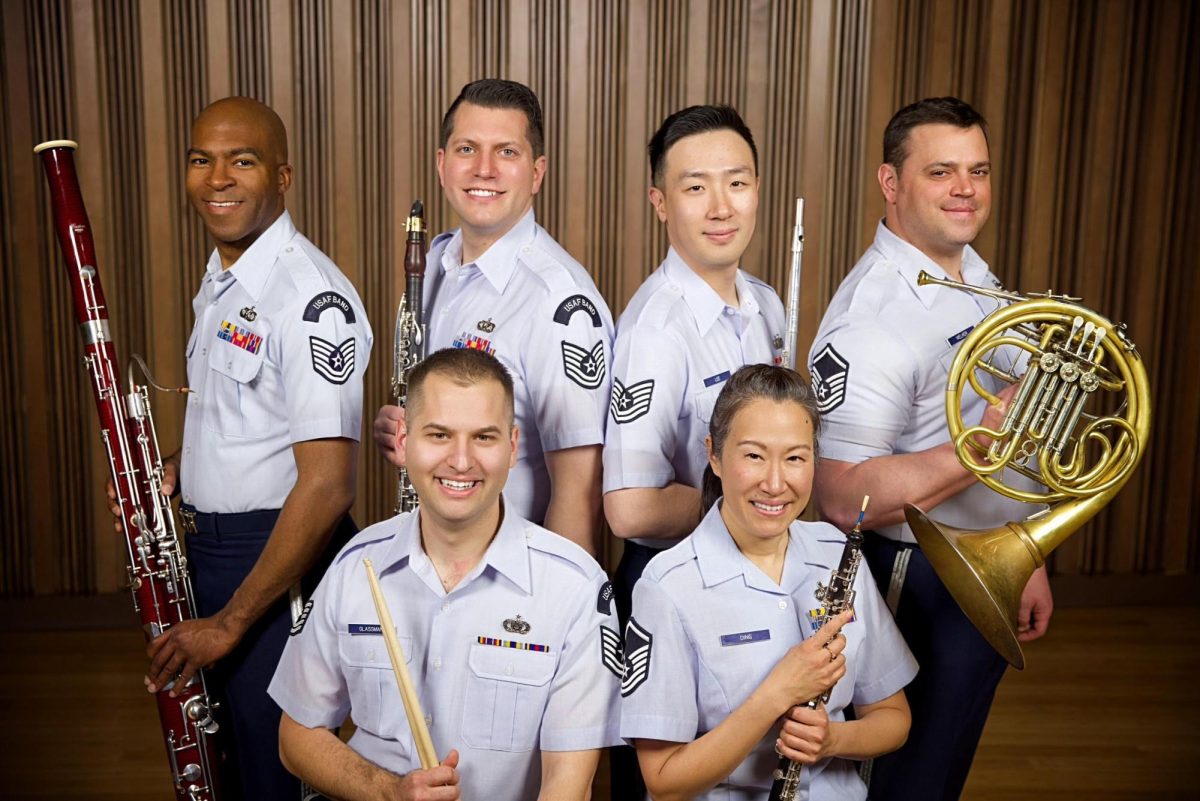 A member of the USAF, the Academy Winds ensemble, poses for a picture.