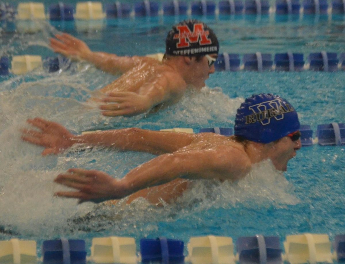 Boys swimming competes at local meets